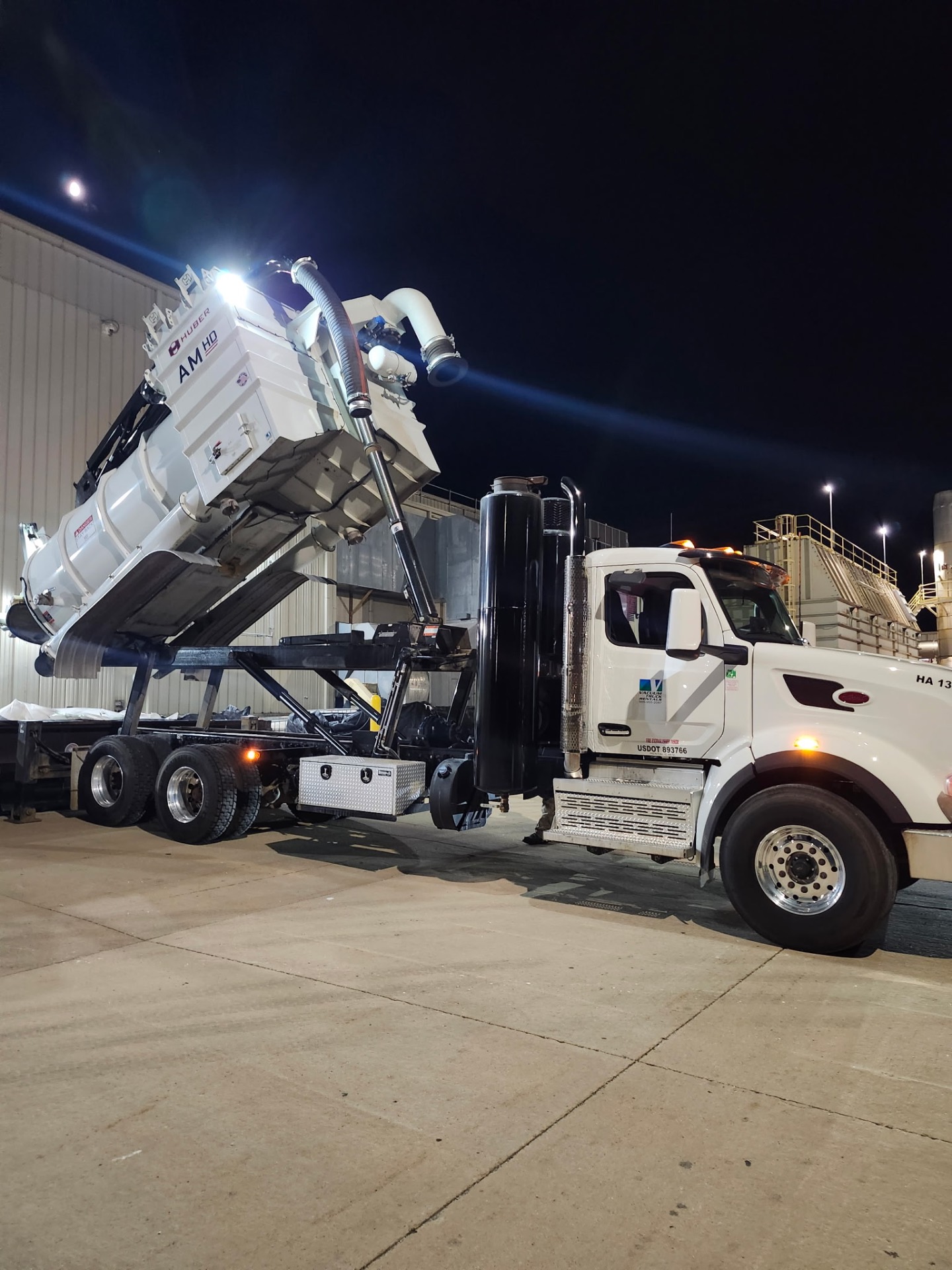 Industrial vacuum truck at a manufacturing facility